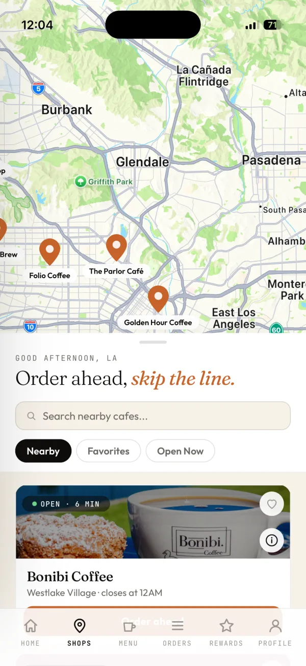 Allstreet Coffee app shops screen with a map of cafes and a nearby shop card